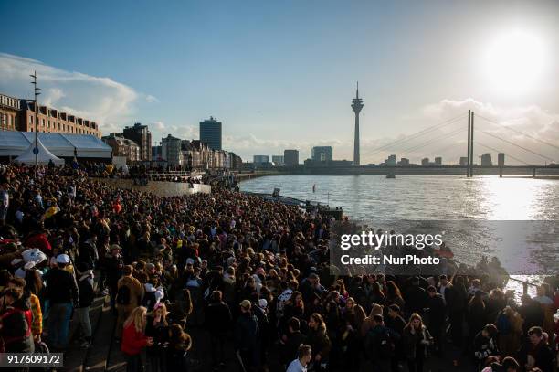 During the afternoon, hundreds of young people gather around the Rhine river, to celebrate Carnaval after the Rose Monday Parade in Dusseldorf,...