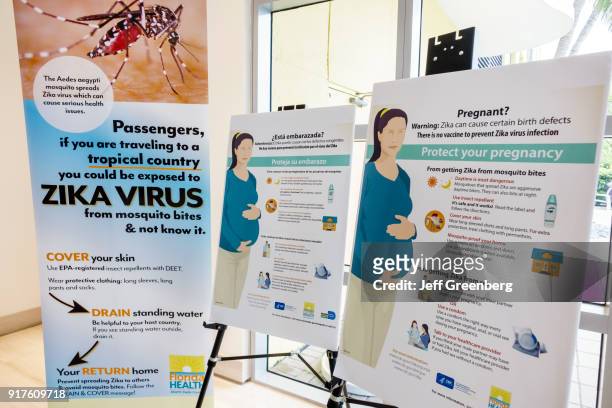 Zika Virus Town Hall Meeting posters at Waverly Condominiums.