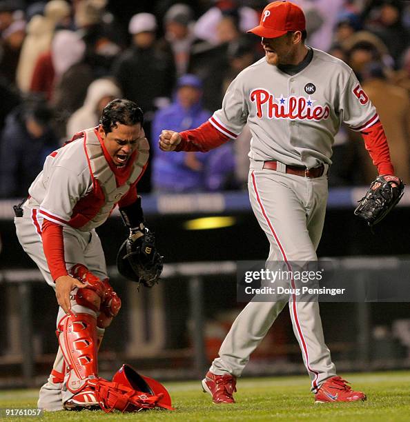 Pitcher Brad Lidge and catcher Carlos Ruiz of the Philadelphia Phillies celebrate their win over the Colorado Rockies during Game 3 of their National...