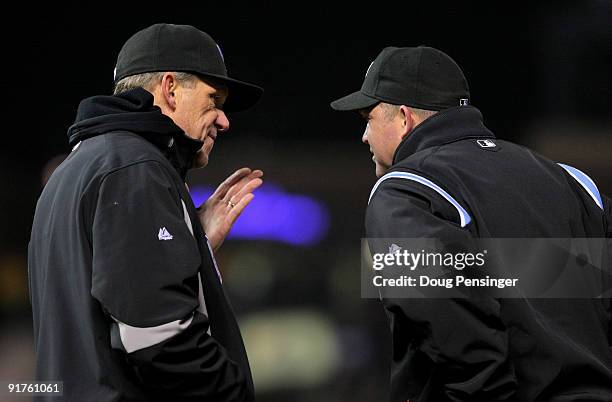 Manager Jim Tracy of the Colorado Rockies contests a call with first base umpire Ron Kulpa when Chase Utley of the Philadelphia Phillies was called...