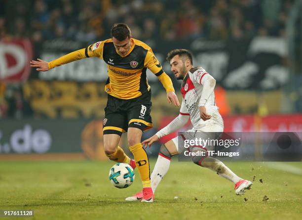 Philip Heise of Dresden and Cenk Sahin of St. Pauli battle for the ball during the Second Bundesliga match between SG Dynamo Dresden and FC St. Pauli...