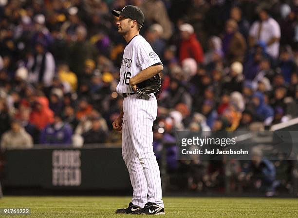 Huston Street of the Colorado Rockies watches the game-winning sacrifice fly which was hit by Ryan Howard of the Philadelphia Phillies in the top of...