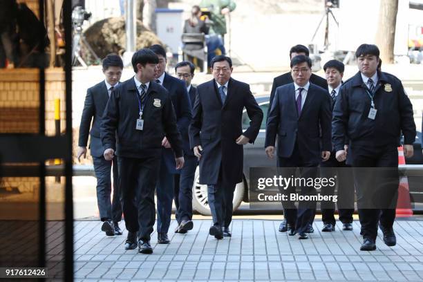 Shin Dong-bin, chairman of Lotte Group, center, arrives at the Seoul Central District Court in Seoul, South Korea, on Tuesday, Feb. 13, 2018. The...