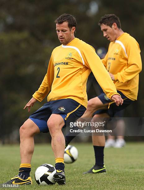 Lucas Neill of the Socceroos controls the ball at an Australian Socceroos training session at Monash University on October 12, 2009 in Melbourne,...
