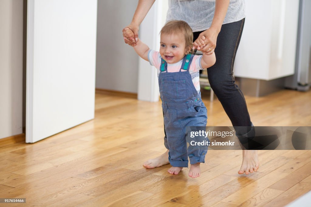 Baby Boy Taking First Steps High-Res Stock Photo - Getty Images