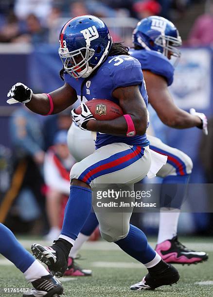 Gartrell Johnson of the New York Giants runs the ball against the Oakland Raiders on October 11, 2009 at Giants Stadium in East Rutherford, New...