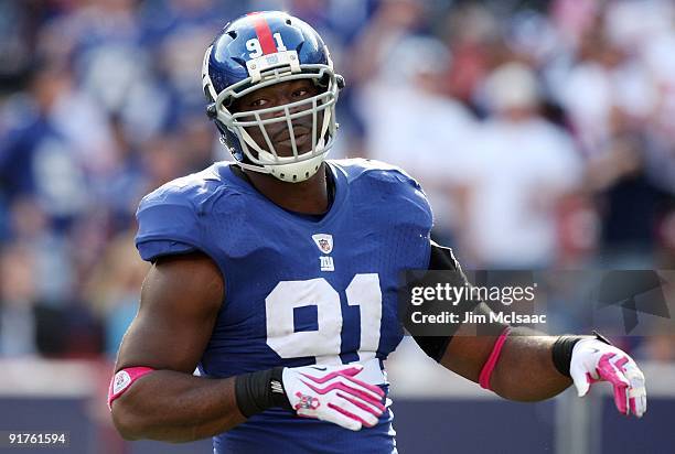 Justin Tuck of the New York Giants looks on against the Oakland Raiders on October 11, 2009 at Giants Stadium in East Rutherford, New Jersey. The...