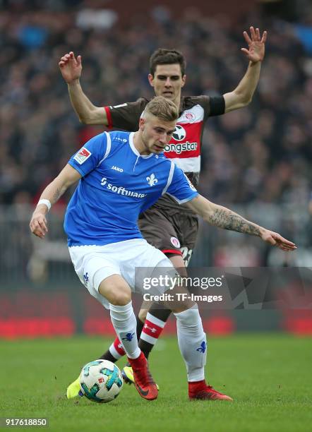 Felix Platte of Darmstadt and Johannes Flum of St. Pauli battle for the ball during the Second Bundesliga match between FC St. Pauli and SV Darmstadt...