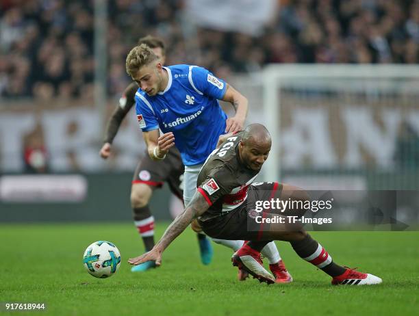 Felix Platte of Darmstadt and Christopher Avevor of St. Pauli battle for the ball during the Second Bundesliga match between FC St. Pauli and SV...