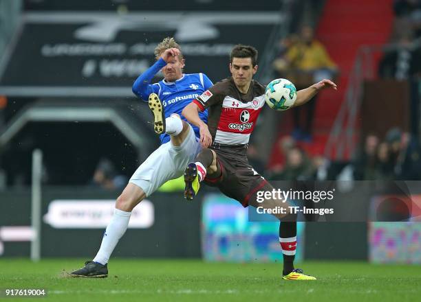 Jan Rosenthal of Darmstadt and Johannes Flum of St. Pauli battle for the ball during the Second Bundesliga match between FC St. Pauli and SV...