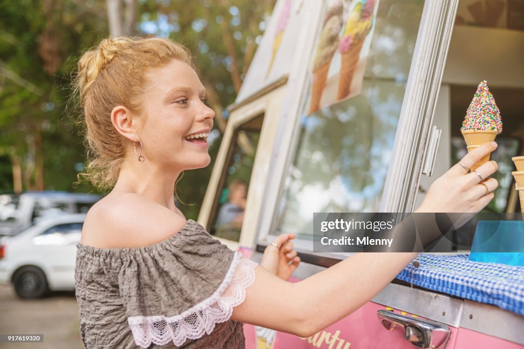 Young Woman Buying Ice Cream from Food Truck