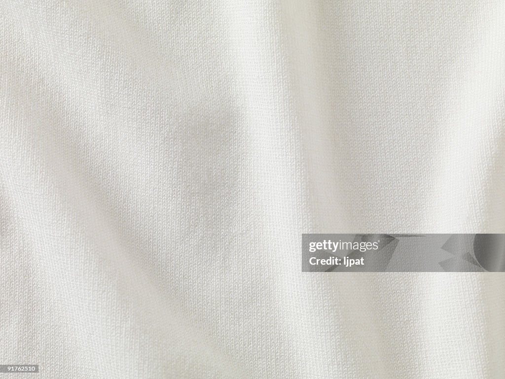 A close-up of white fabric forming a background