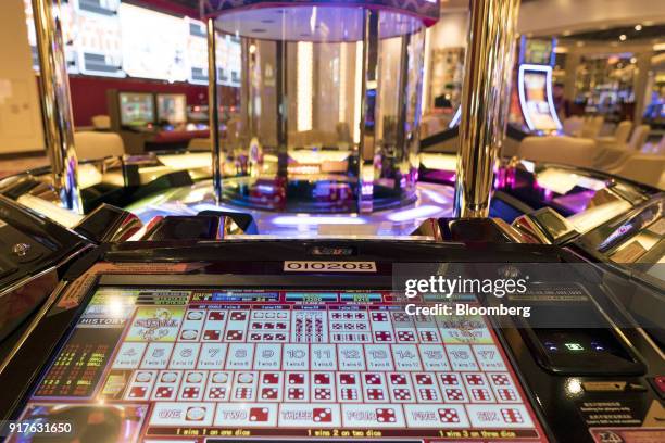 Gaming machine stands on the floor of the casino at the MGM Cotai casino resort, developed by MGM China Holdings Ltd., in Macau, China, on Tuesday,...