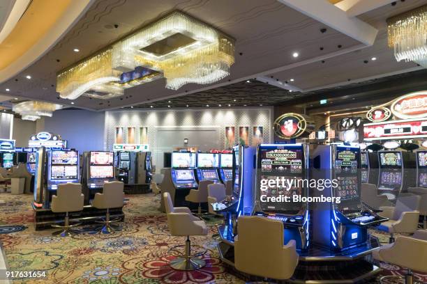 Slot machines stand on the gaming floor of the casino at the MGM Cotai casino resort, developed by MGM China Holdings Ltd., in Macau, China, on...