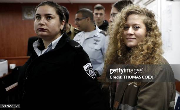 Seventeen-year-old Palestinian Ahed Tamimi , a well-known campaigner against Israel's occupation, stands for the beginning of her trial in the...