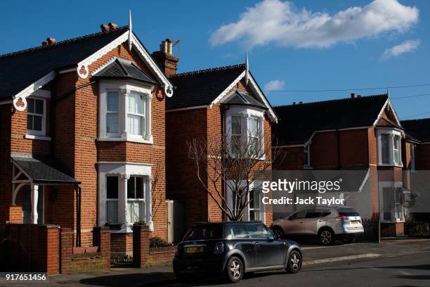 Row of houses stand on a residential street on February 12, 2018 in Weybridge, United Kingdom. Surrey County Council have approved the highest...