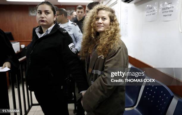 Seventeen-year-old Palestinian Ahed Tamimi , a well-known campaigner against Israel's occupation, stands for the beginning of her trial in the...