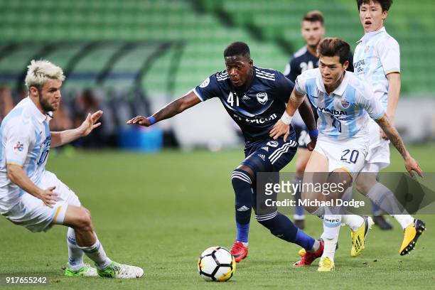 Leroy George of the Victory compete for the ball against Kim SungJu of Ulsan Hyundai during the AFC Asian Champions League match between the...