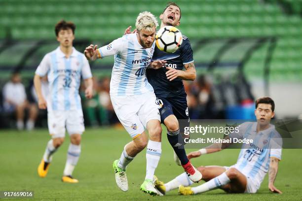 Richard Windbichler of Ulsan Hyundai and James Troisi of the Victory compete for the ball during the AFC Asian Champions Leagu between the Melbourne...