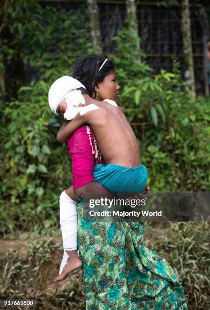 Rohingya Muslims refugee caring her sister after medical treatment at Balu khali camp teknaf.