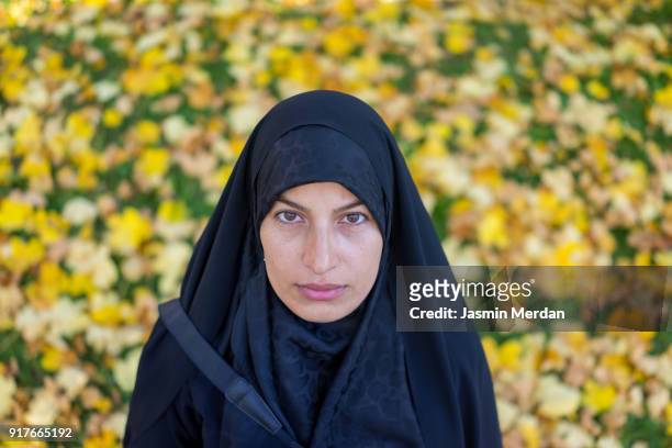 muslim woman with hijab with camera in nature - iranian stockfoto's en -beelden