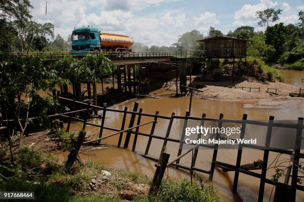 Oil extraction and pollution in the Amazon Huaorani Amerindians trying to survive through eco-tourism against the threat of oil multinationals....