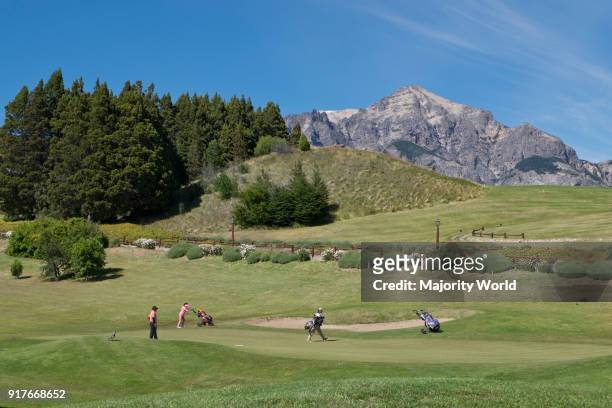 Exclusive golf course with views of Andes mountains by lake Nahuel Huapi in Bariloche, Argentina.