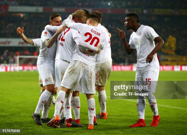 Jorge Mere of Koeln celebrates after scoring his team`s second goal with Salih Oezcan of Koeln, Marco Hoeger of Koeln and Jhon Cordoba of Koeln...
