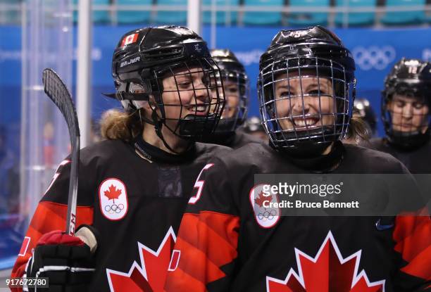 Emily Clark and Melodie Daoust of Canada react after defeating Team Finland 4-1 in the Women's Ice Hockey Preliminary Round - Group A game on day...