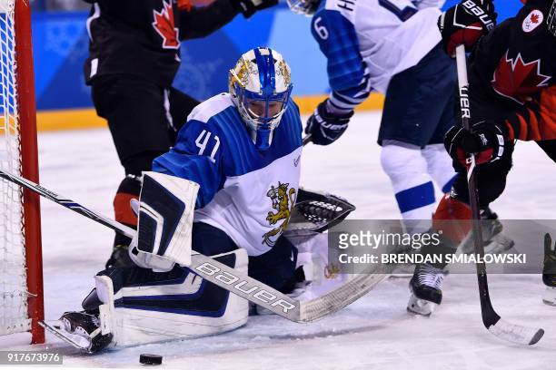 Finland's Noora Raty defends the goal during the final period of the women's preliminary round ice hockey match between Canada and Finland during the...