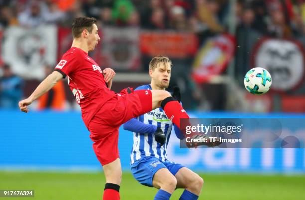 Dominik Kohr of Leverkusen and Arne Maierbattle for the ball during the Bundesliga match between Bayer 04 Leverkusen and Hertha BSC at BayArena on...