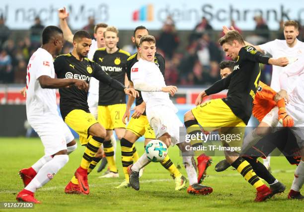 Jhon Cordoba of Koeln, Jeremy Toljan of Dortmund, Salih Oezcan of Koeln, Lukasz Piszczek of Dortmund and Goalkeeper Roman Buerki of Dortmund battle...