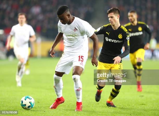 Jhon Cordoba of Koeln and Julian Weigl of Dortmund battle for the ball during the Bundesliga match between 1. FC Koeln and Borussia Dortmund at...