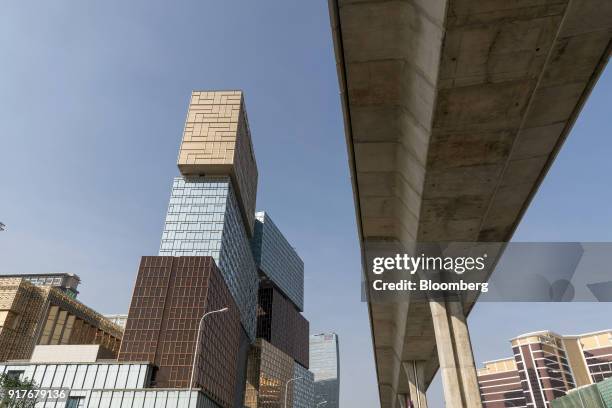 The MGM Cotai casino resort, developed by MGM China Holdings Ltd., left, stands near an overpass in Macau, China, on Tuesday, Feb. 13, 2018. MGM...