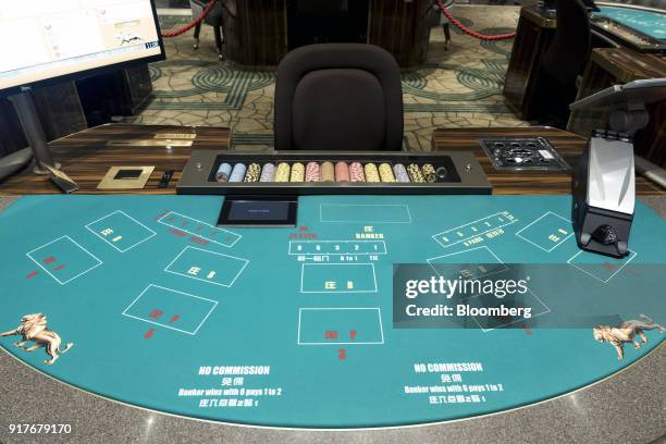 Blackjack table stands on the floor of the casino at the MGM Cotai casino resort, developed by MGM China Holdings Ltd., in Macau, China, on Tuesday,...