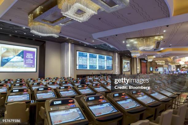 Machines sit on the gaming floor of the casino at the MGM Cotai casino resort, developed by MGM China Holdings Ltd., in Macau, China, on Tuesday,...