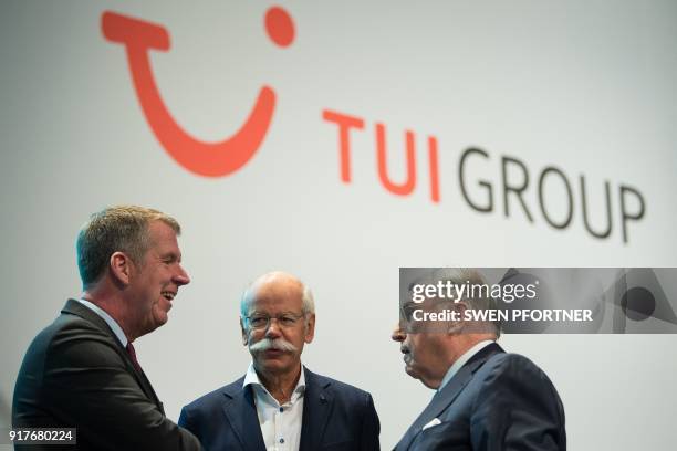 Friedrich Joussen , CEO of German tourism giant TUI, talks with Dieter Zetsche, CEO of German auto giant Daimler AG, and Klaus Mangold , Chairman of...