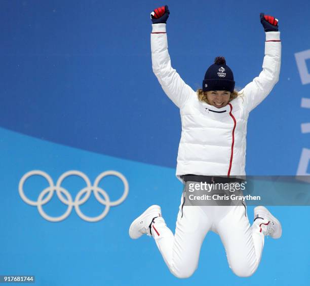 Bronze medalist Anais Bescond of France jumps during the medal ceremony after the Women's Biathlon 10km Pursuit on day four of the PyeongChang 2018...