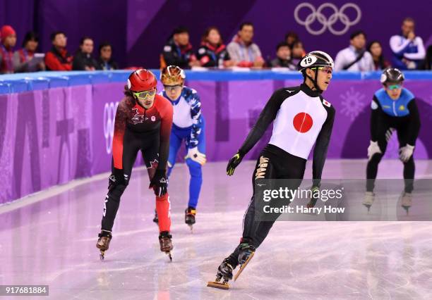 Samuel Girard of Canada, Keita Watanabe of Japan, Semen Elistratov of Olympic Athlete from Russia and Nurbergen Zhumagaziyev of Kazakhstan react...