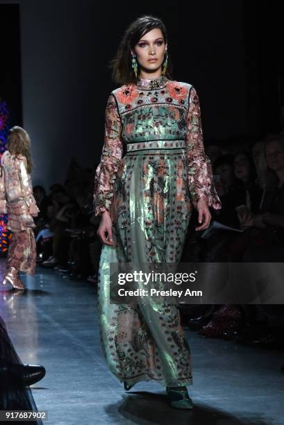 Bella Hadid walks the runway at Anna Sui - Runway - February 2018 - New York Fashion Week: at Spring Studios on February 12, 2018 in New York City.