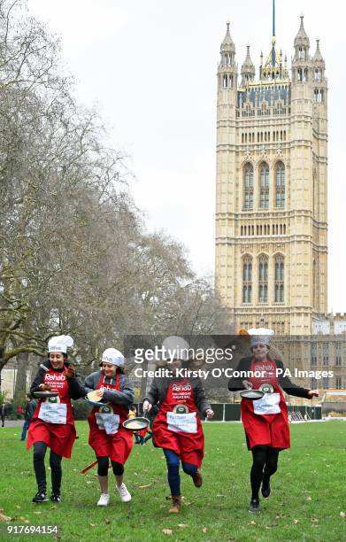 Participants take part in the annual Parliamentary Pancake Race, featuring teams of MPs, Lords and political journalists in aid of the Rehab...