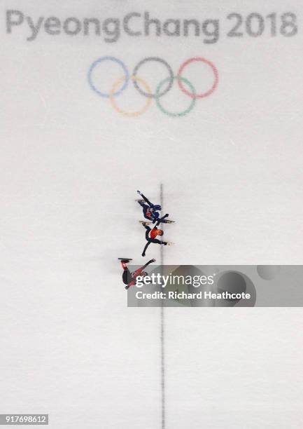 Yara Van Kerkhof of the Netherlands edges out Elise Christie of Great Britain and Kim Boutin of Canada at the finish line during the Ladies' 500m...