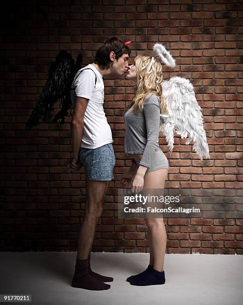 angel and devil - angel funny stock pictures, royalty-free photos & images