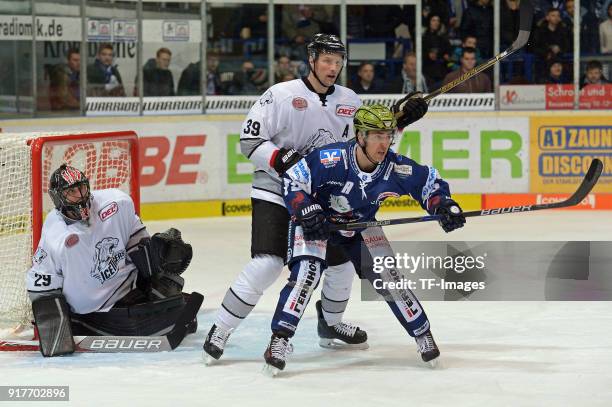 Goalkeeper Andreas Jenike of Nuernberg, David Steckel of Nuernberg and Blaine Down of Iserlohn look on during the DEL match between Iserlohn Roosters...