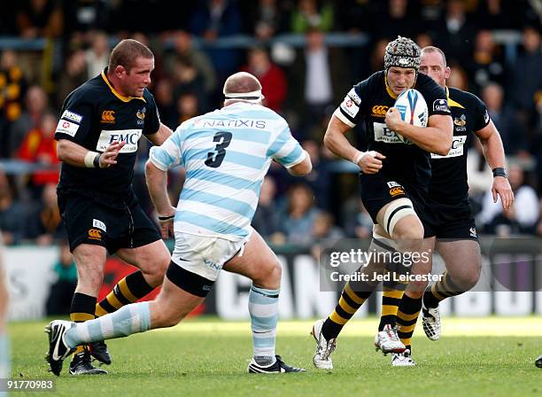 Wasps' Will Matthews bursts through the tackle during the Amlin Challenge Cup match between London Wasps and Racing Metro 92 at the Causeway Stadium....