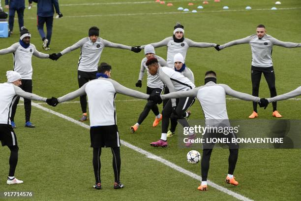 Paris Saint-Germain's players take part in a training session at in Saint-Germain-en-Laye, on February 13, 2018 on the eve of the Champions' League...