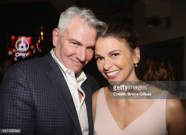 Douglas Sills and Sutton Foster pose at the "Thoroughly Modern Millie" 15th Anniversary Reunion Concert After Party at Opry City Stage on February...