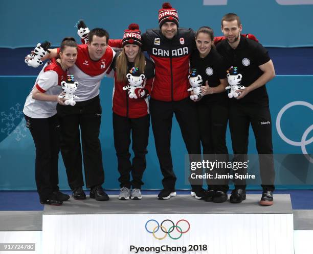 Silver medal winners Jenny Perret and Martin Rios of Switzerland, Gold medal winners Kaitlyn Lawes and John Morris of Canada, and Anastasia...