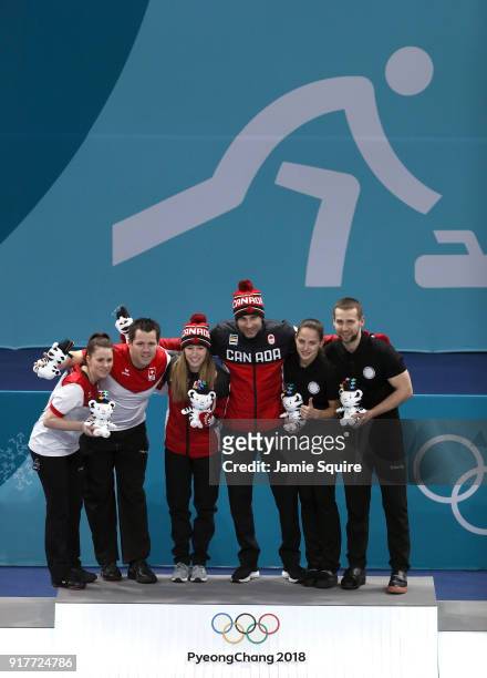 Silver medal winners Jenny Perret and Martin Rios of Switzerland, Gold medal winners Kaitlyn Lawes and John Morris of Canada, and Anastasia...