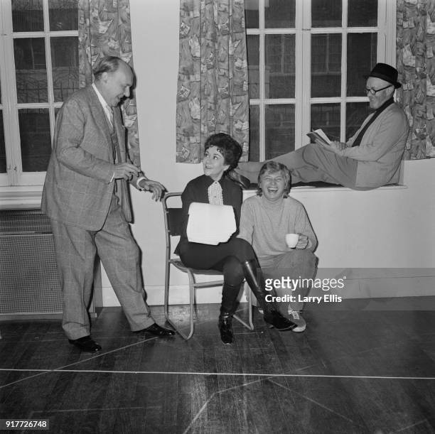 Actors Ralph Richardson , Joan Plowright, Tommy Steele and Alec Guinness reading the script for television production of Twelfth Night for the first...